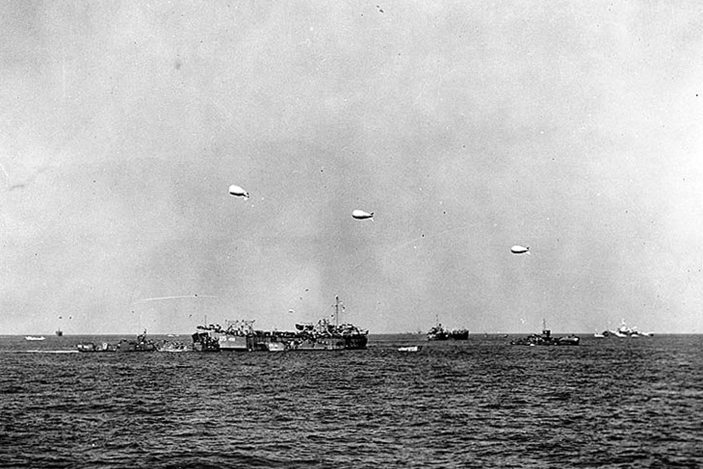 USS LST-499 and other landing ships and craft off "Utah" Beach on 6 June 1944.
